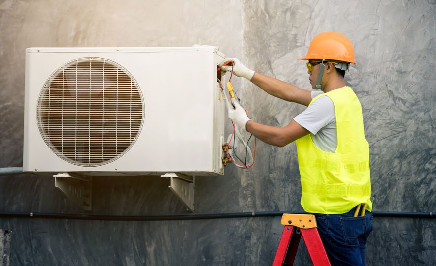 asian man runs the air-conditioning refrigerant from the tank